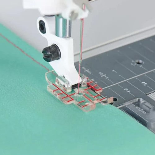 sewing a 1/4" seam with the Husqvarna Viking Clear Quilter's 1/4" Piecing Foot.