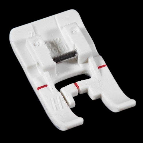 close up of the Husqvarna Viking Non-Stick Glide Foot "H"