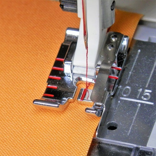 sewing a seam with the Husqvarna Viking Adjustable 1/4" Foot With Guide